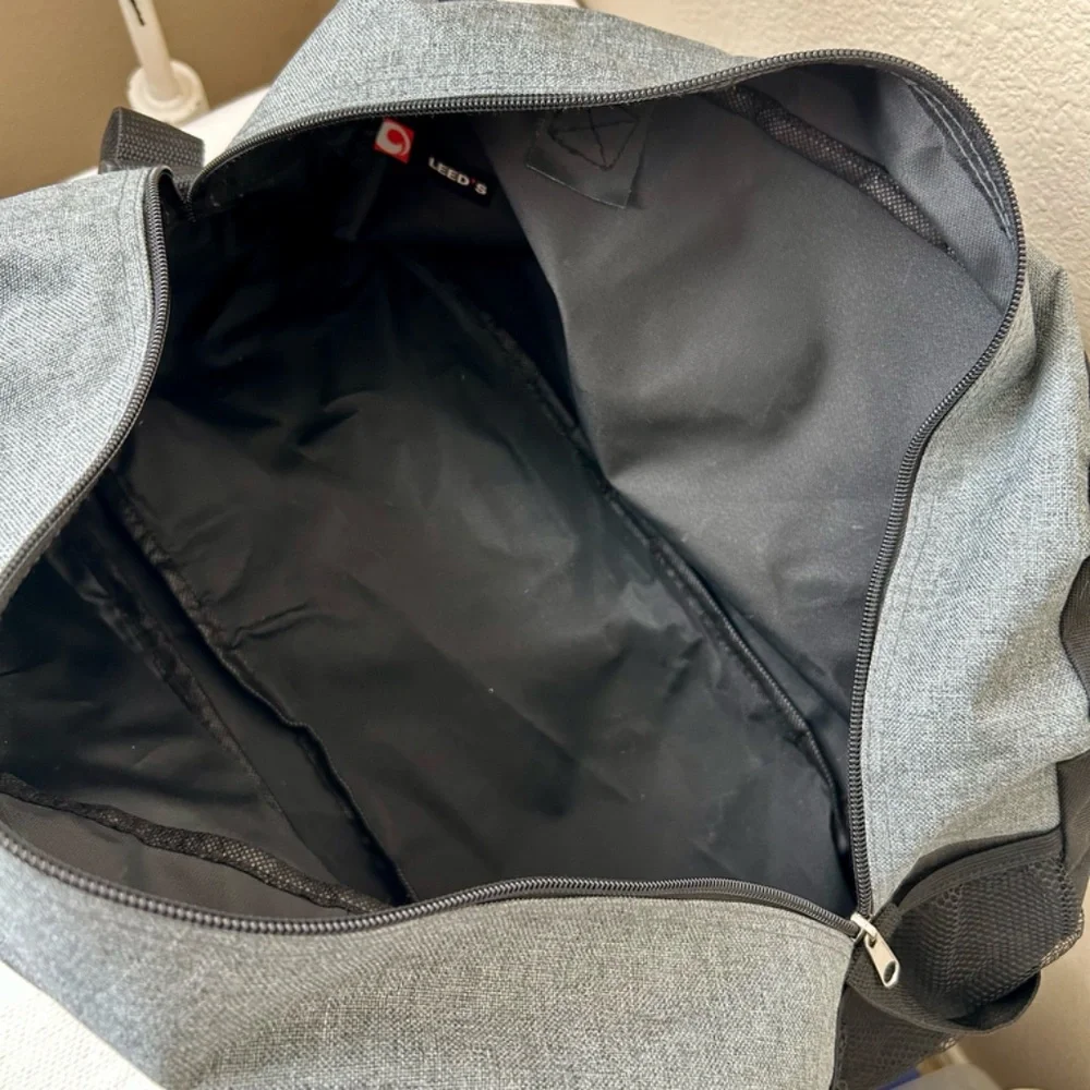 Duke Duffle Bag Gray Black Handles Front zipper pocket side mesh pocket FOREVER